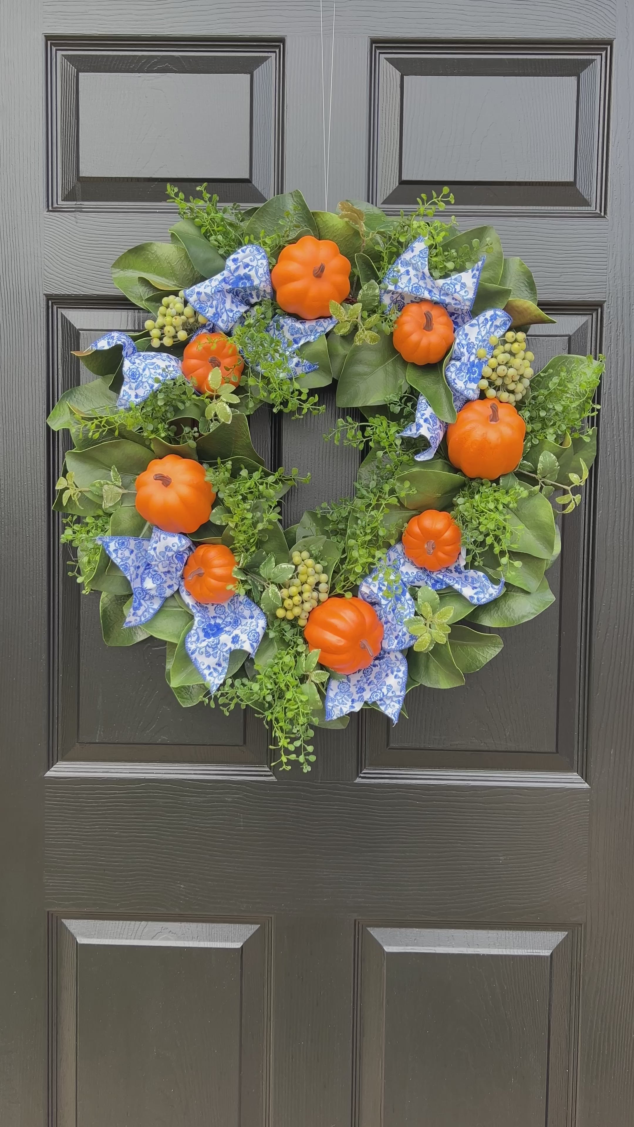 Orange pumpkin wreath with blue and white chinoiserie ribbon