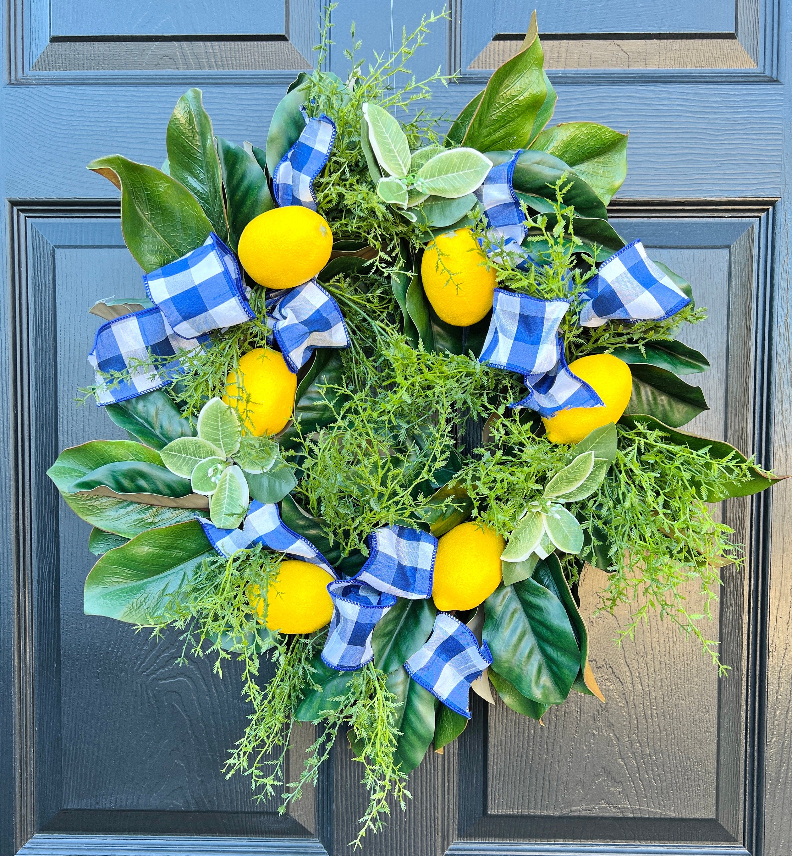 Lemon, herb, and magnolia wreath with blue gingham dupioni ribbon