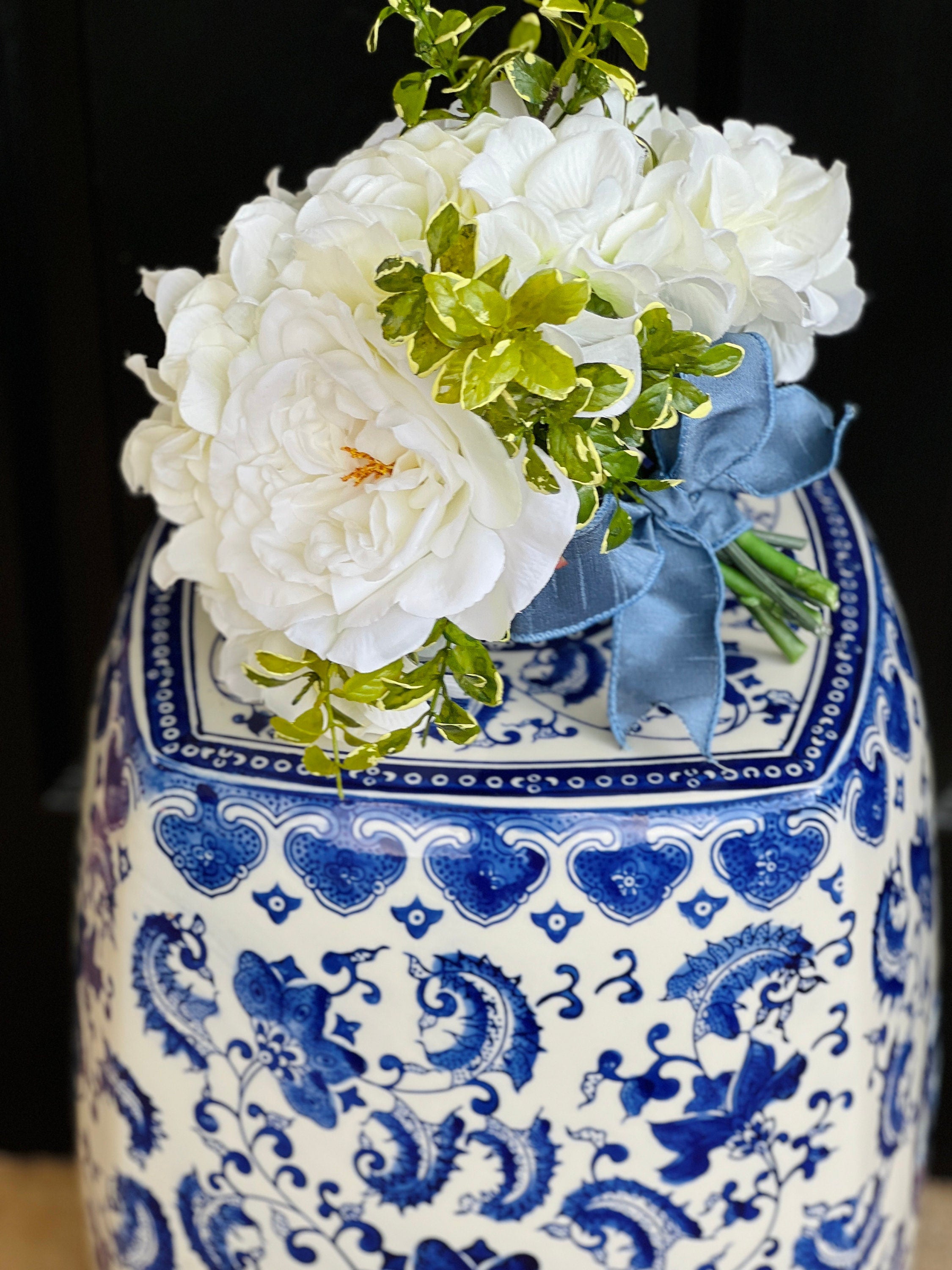 Petite faux floral arrangement in blue and white chinoiserie pot