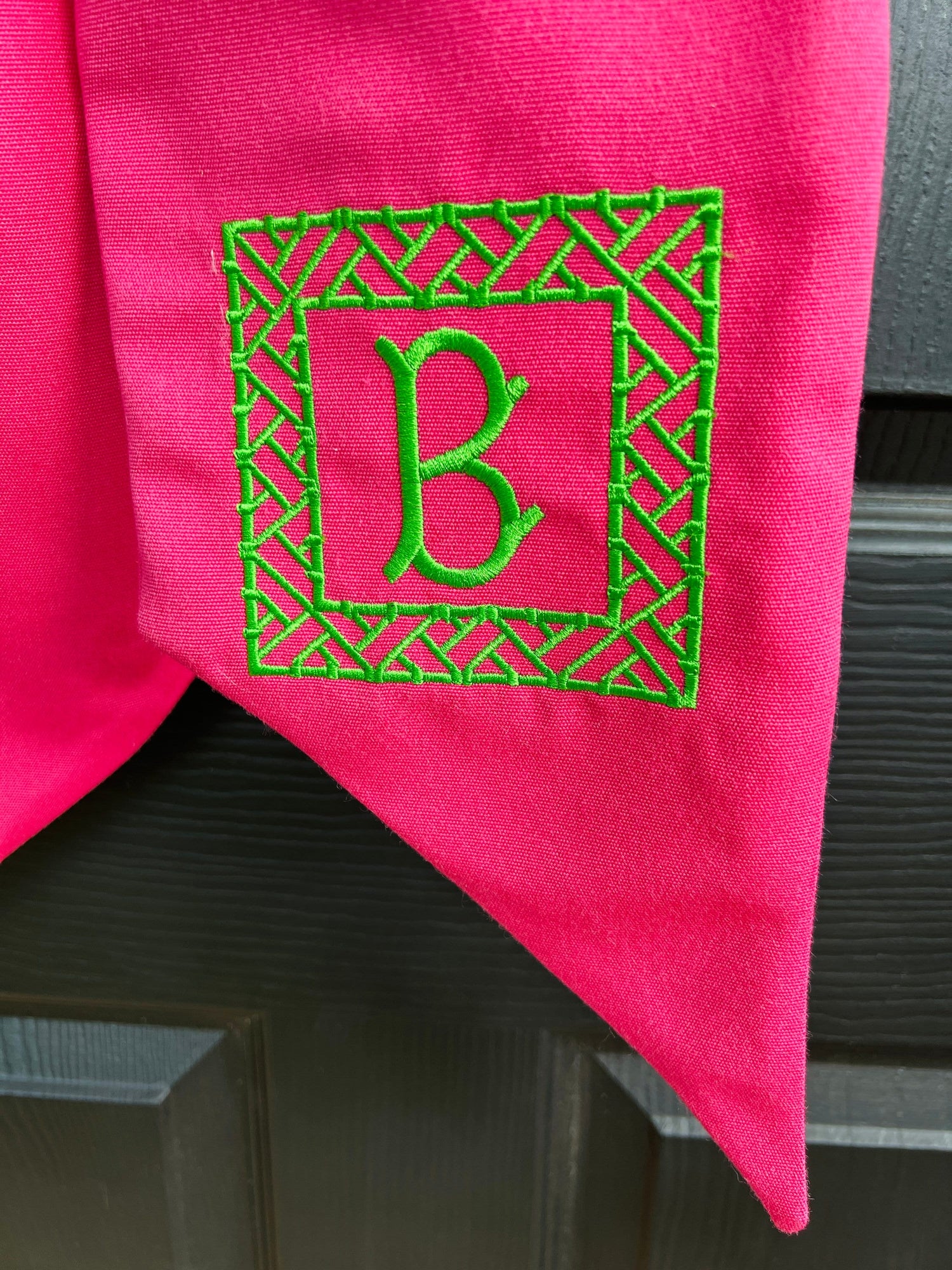 Pink Sunbrella wreath sash available with monogram