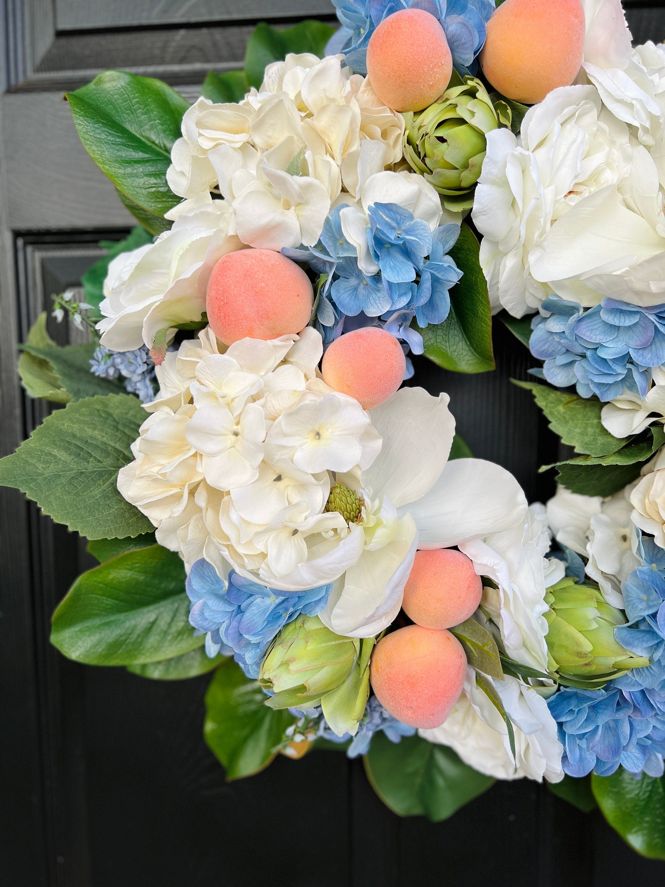 Southern magnolia, peach, and blue hydrangea Summer wreath