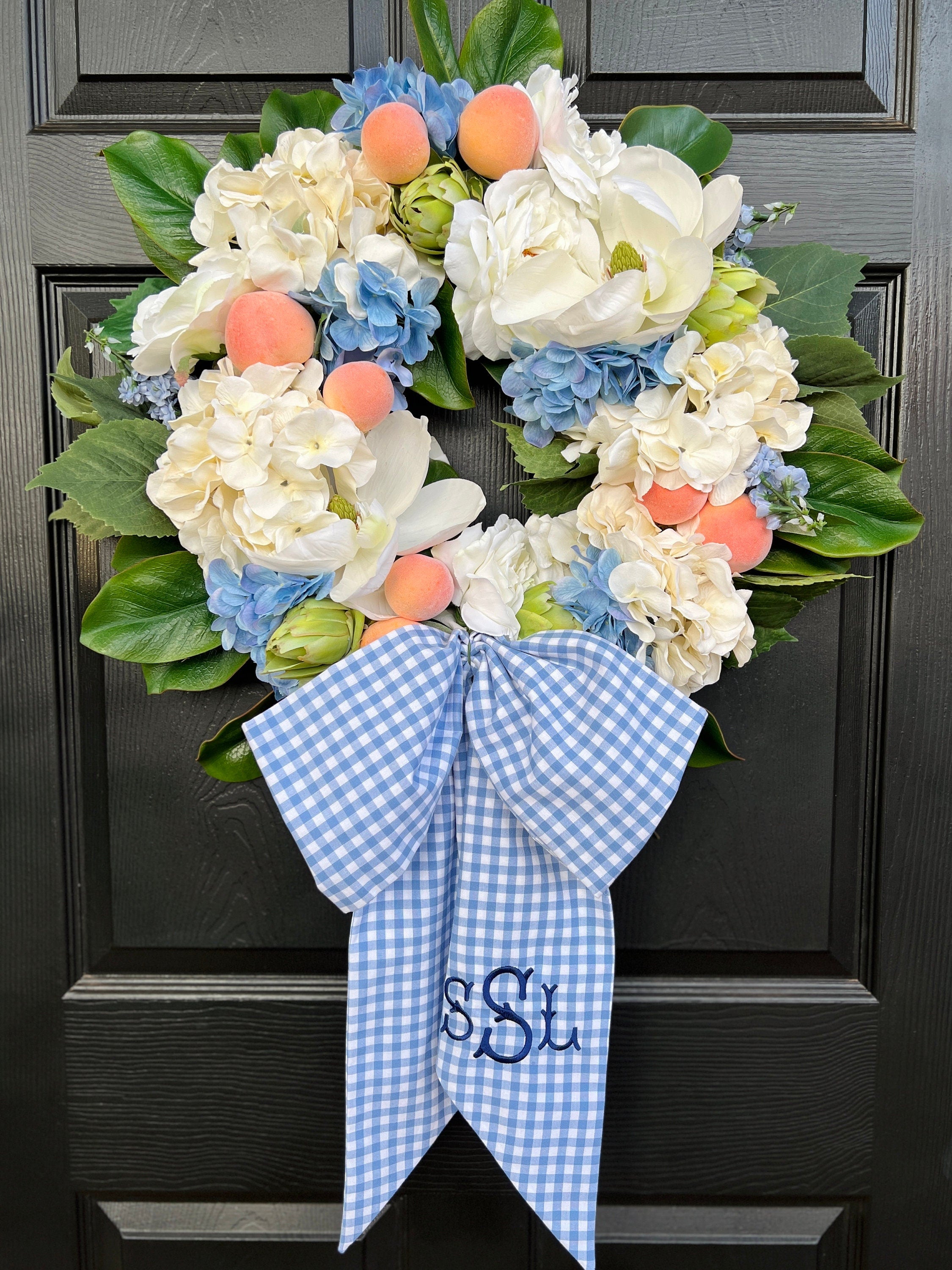 Southern magnolia, peach, and blue hydrangea Summer wreath