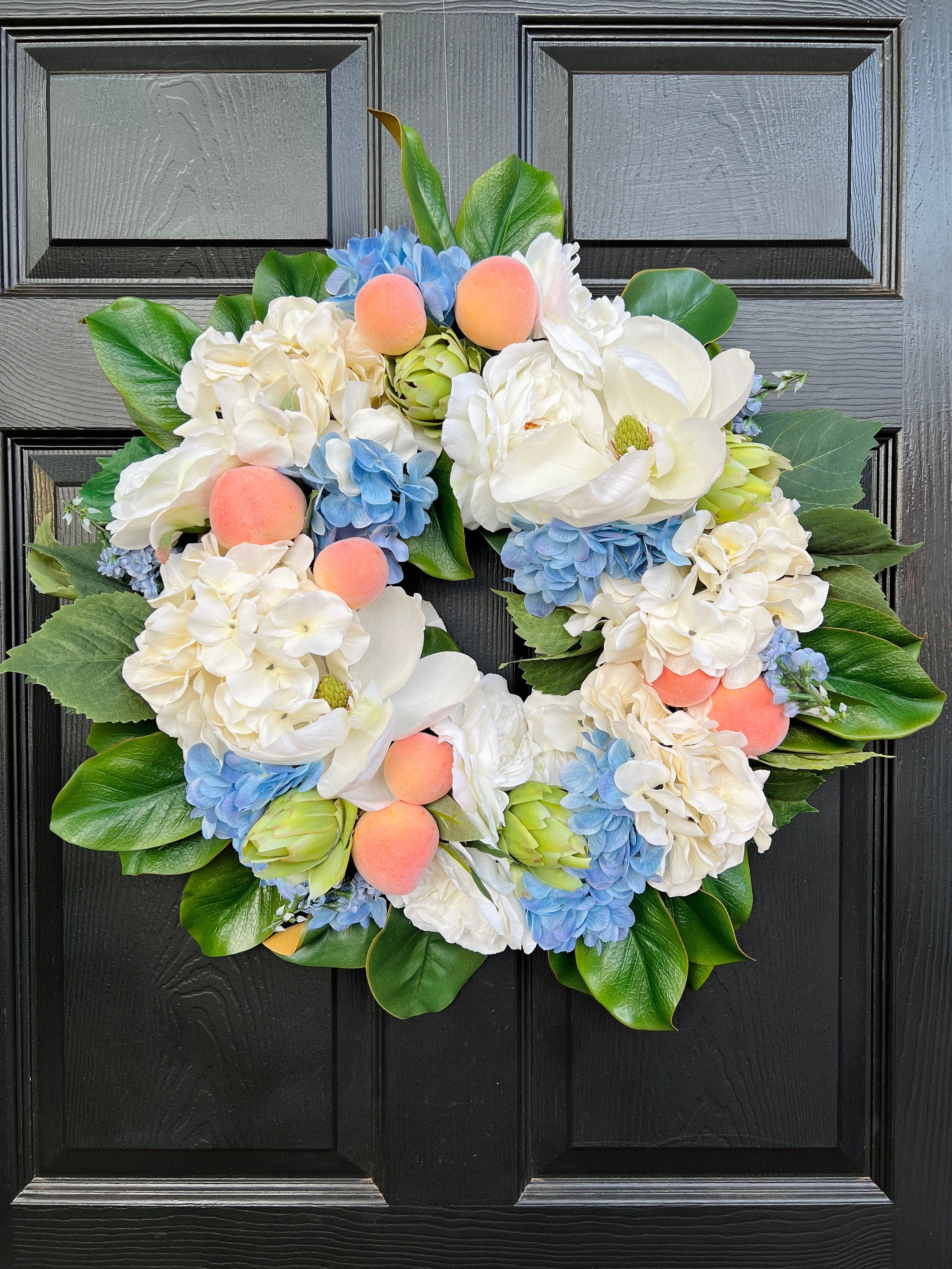 Southern magnolia, peach, and blue hydrangea Summer wreath