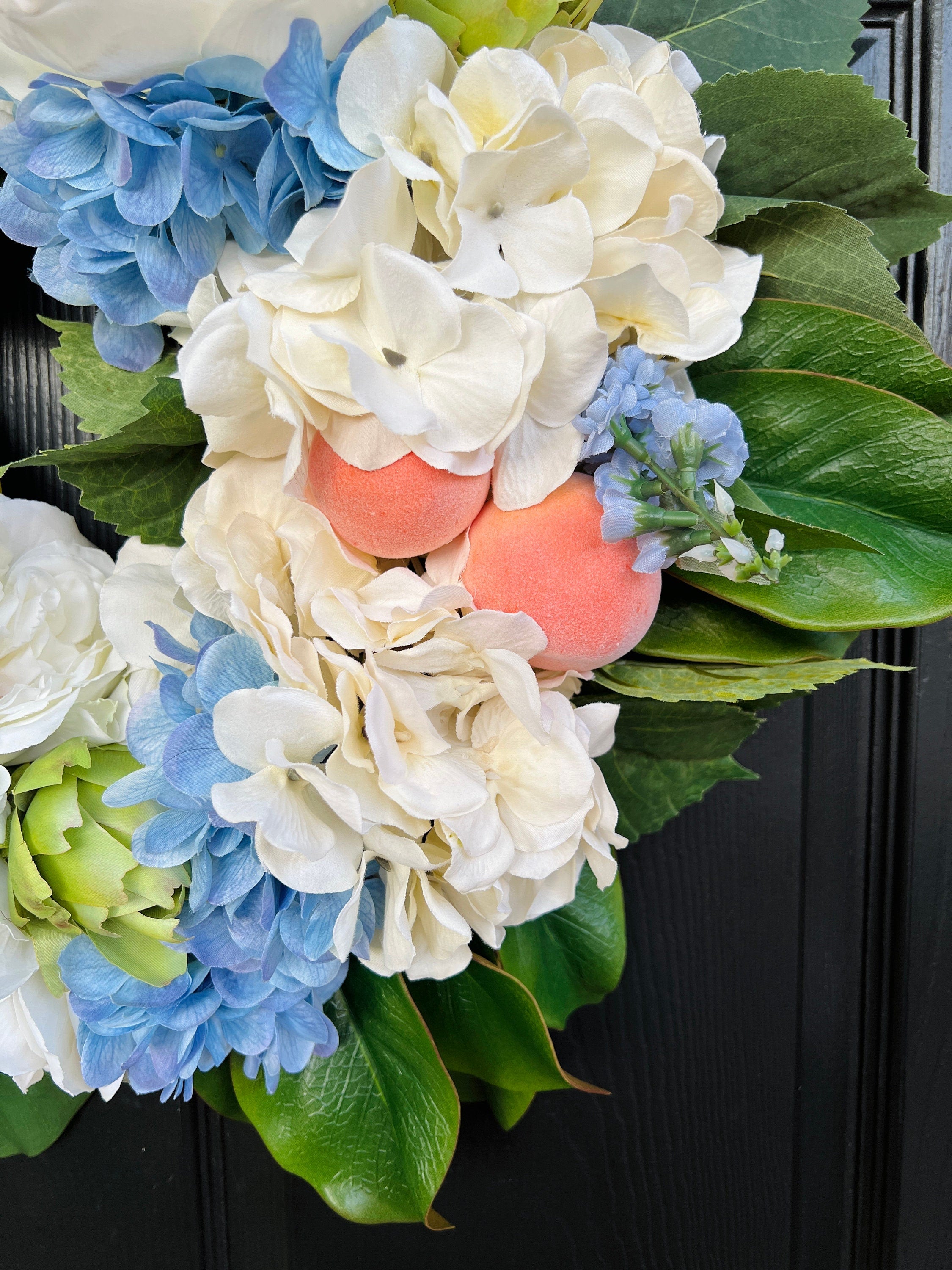 Southern magnolia, peach, and blue hydrangea Summer wreath