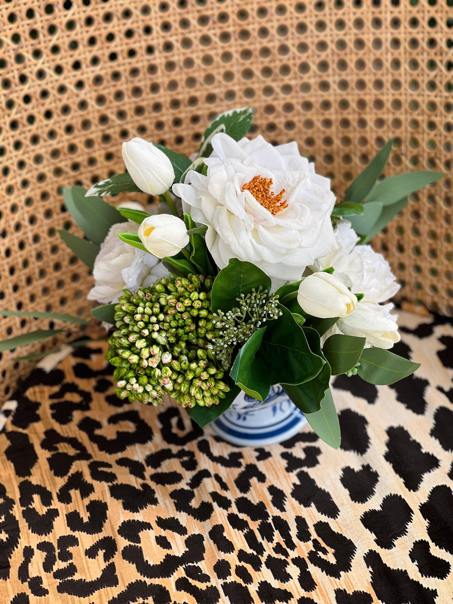 White rose and tulip floral arrangement in chinoiserie footed bowl