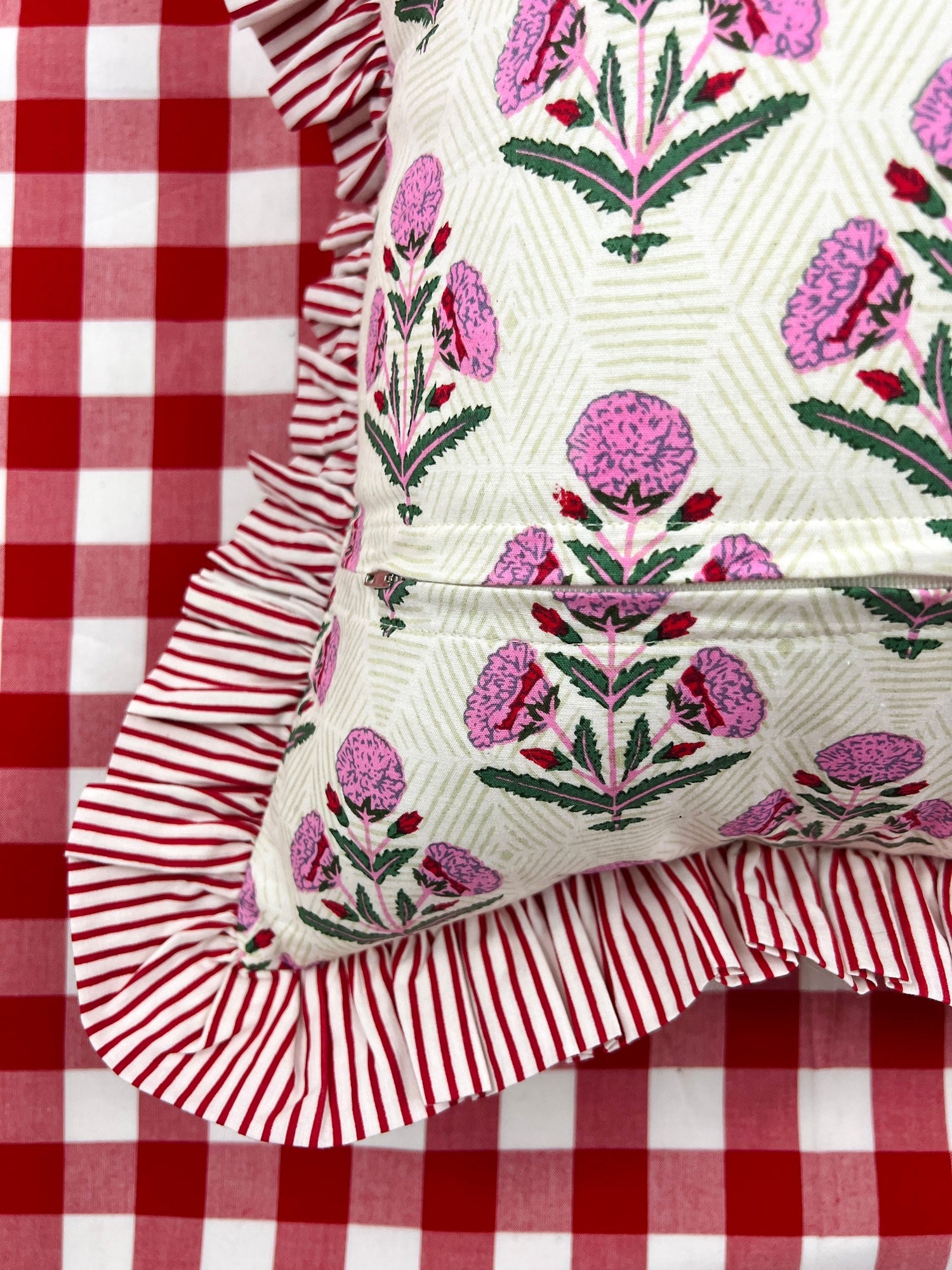 Pink and red floral block print ruffle pillow