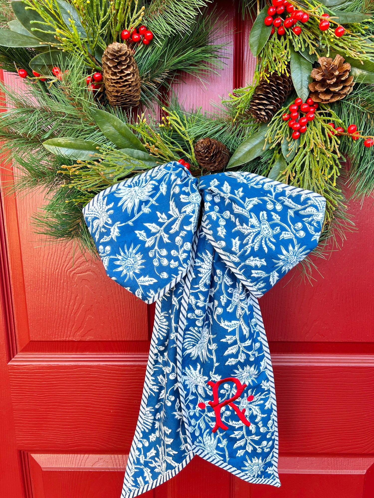 Blue and white block print wreath sash with contrast striped piping,  monogram available