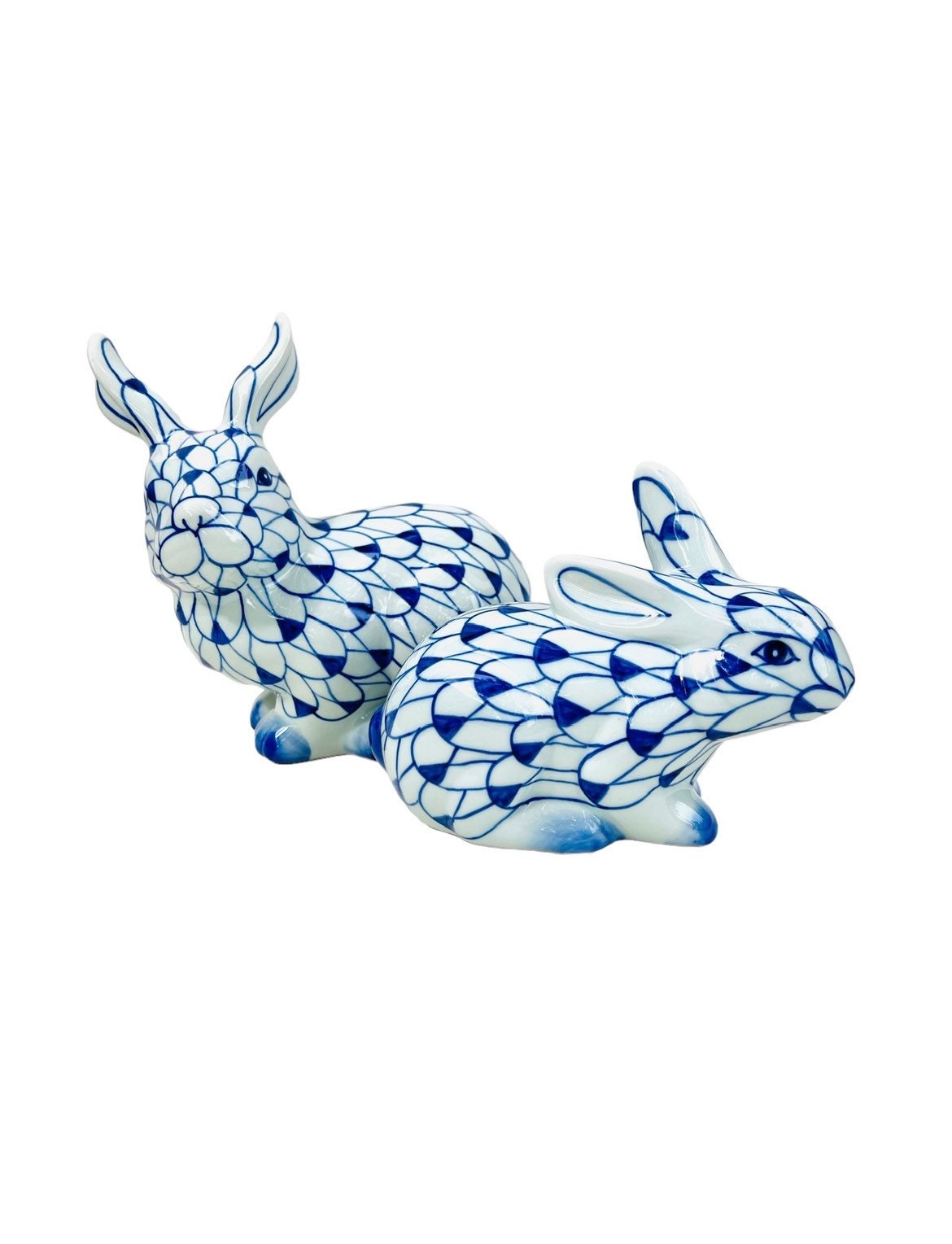 Blue and white fishnet bunny figurine pair