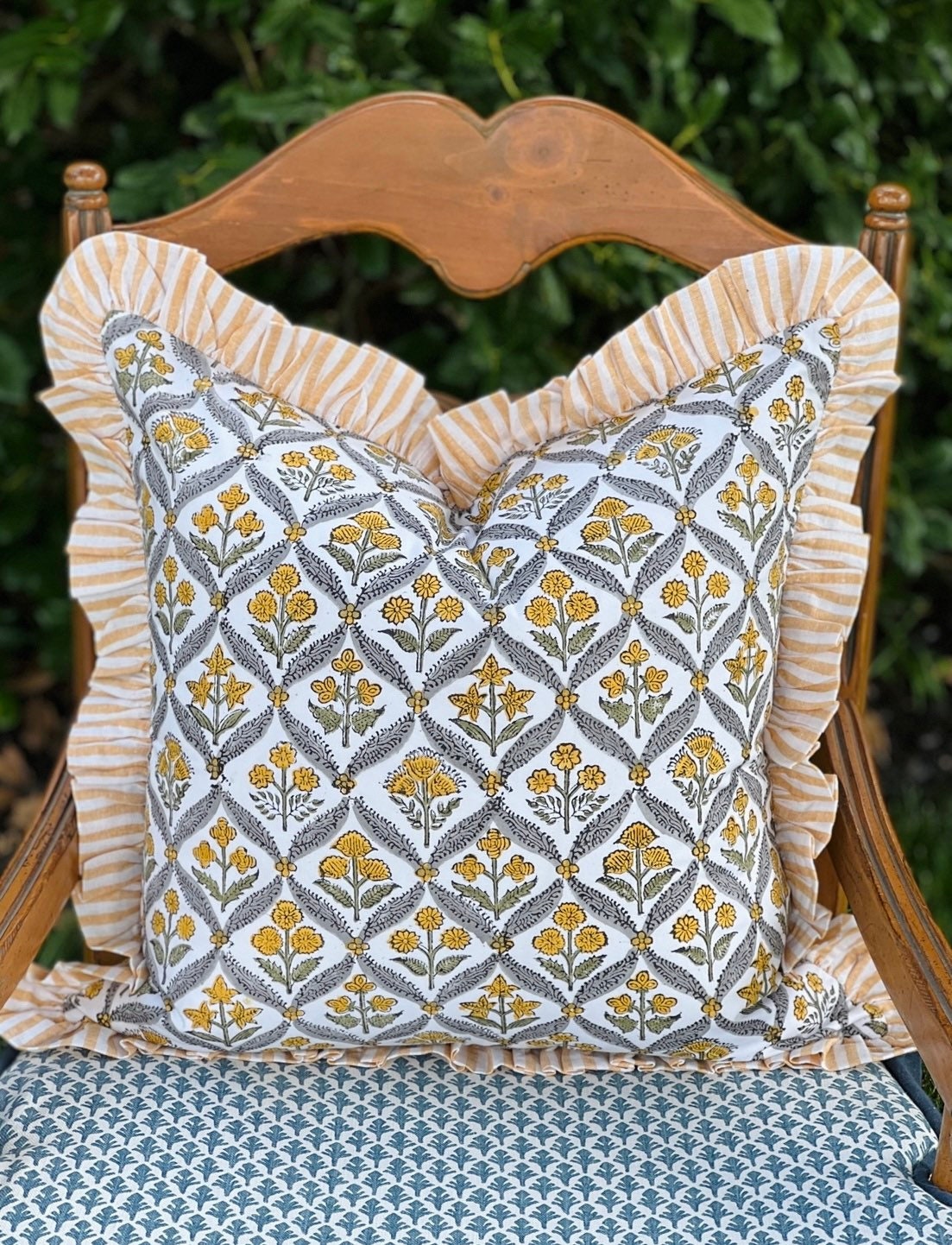Yellow block print pillow cover with ruffle trim