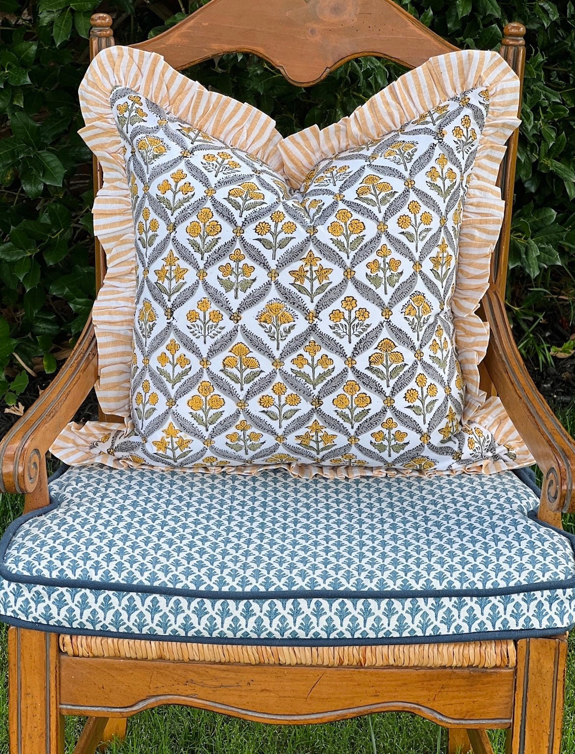 Yellow block print pillow cover with ruffle trim