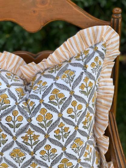 Yellow block print pillow cover with ruffle trim