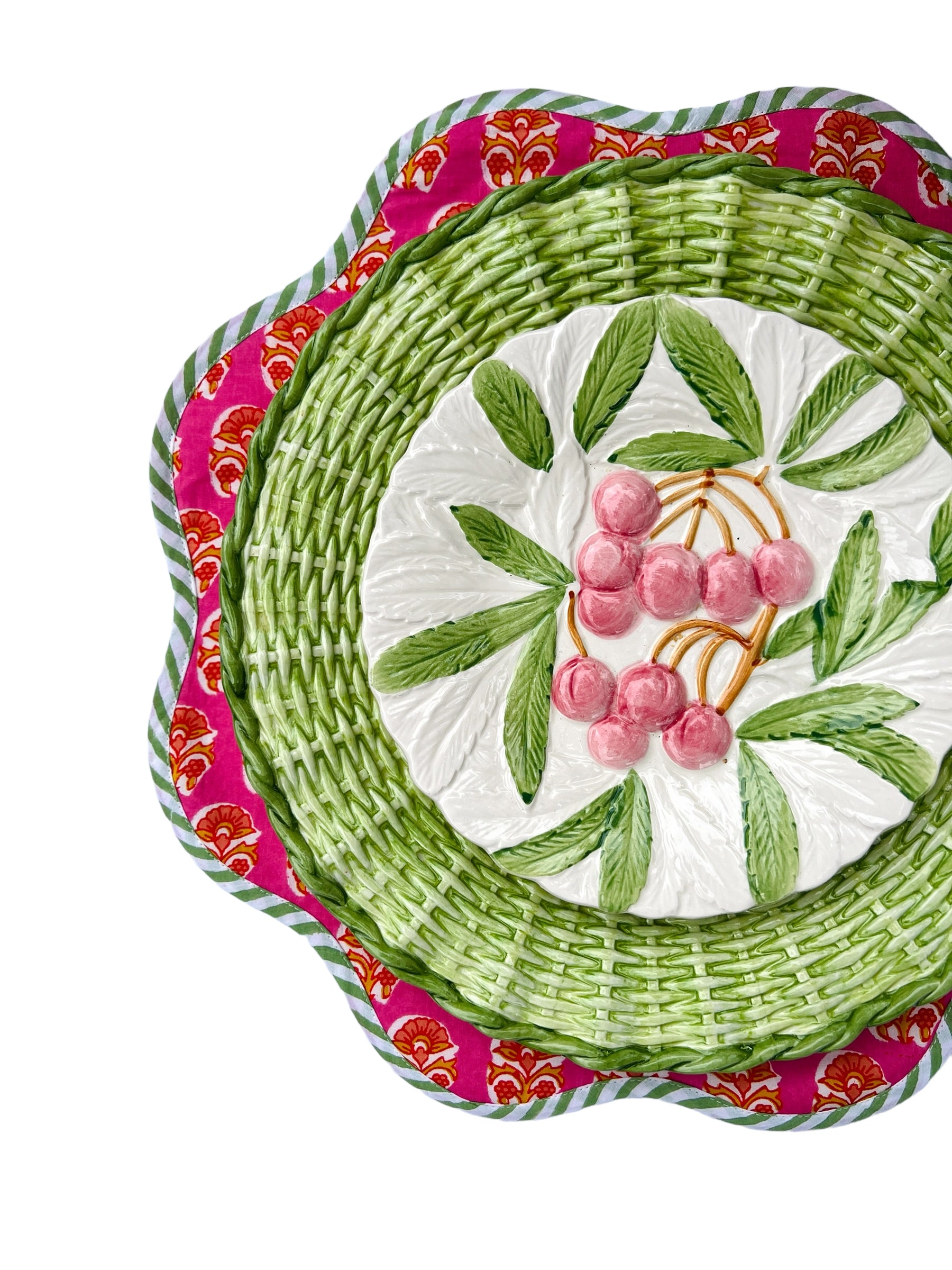 Scalloped bright pink block print placemat set with green and white piping