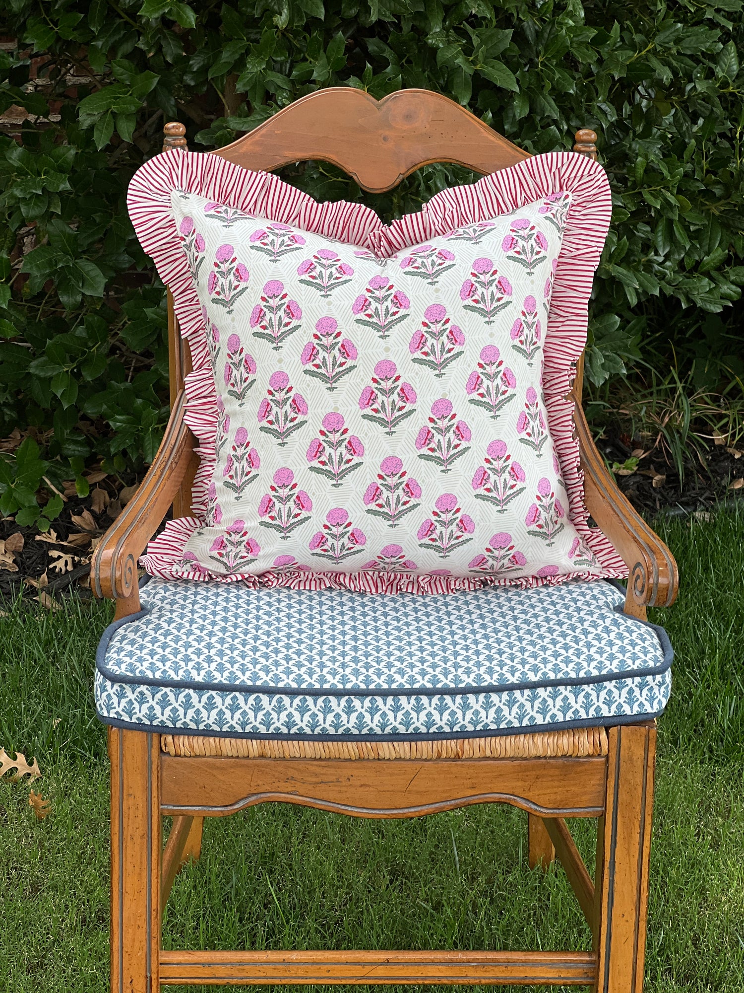 Pink and red floral block print ruffle pillow