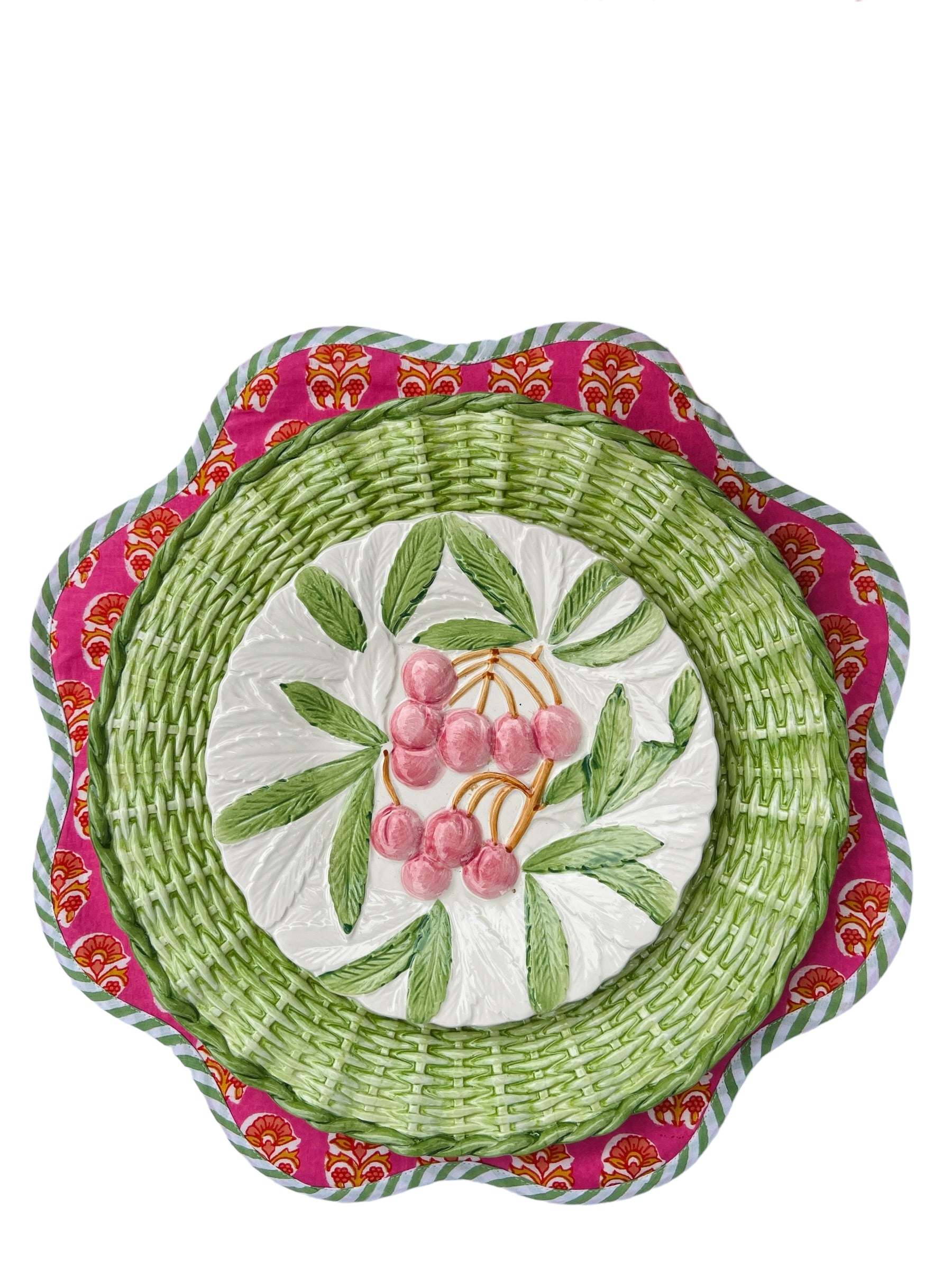 Scalloped bright pink block print placemat set with green and white piping