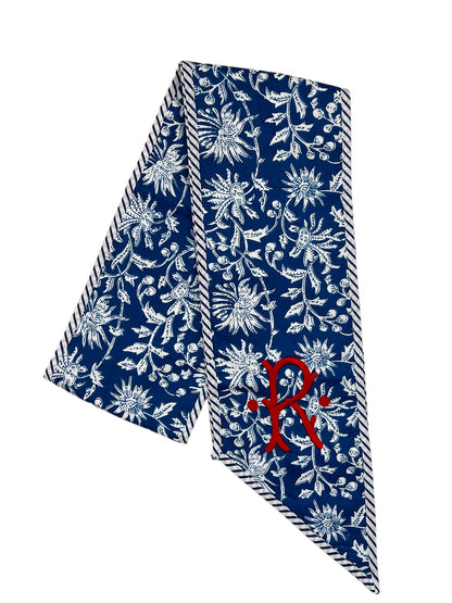 Blue and white block print wreath sash with contrast striped piping, monogram available