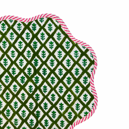 Green block print scalloped placemats with pink and white striped piping, set of 4